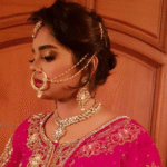 Traditional bridal makeup with flawless base, defined eyes, and soft elegant lipstick.