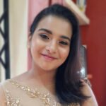 Glam party makeup with soft smokey eyes and glossy nude lips.